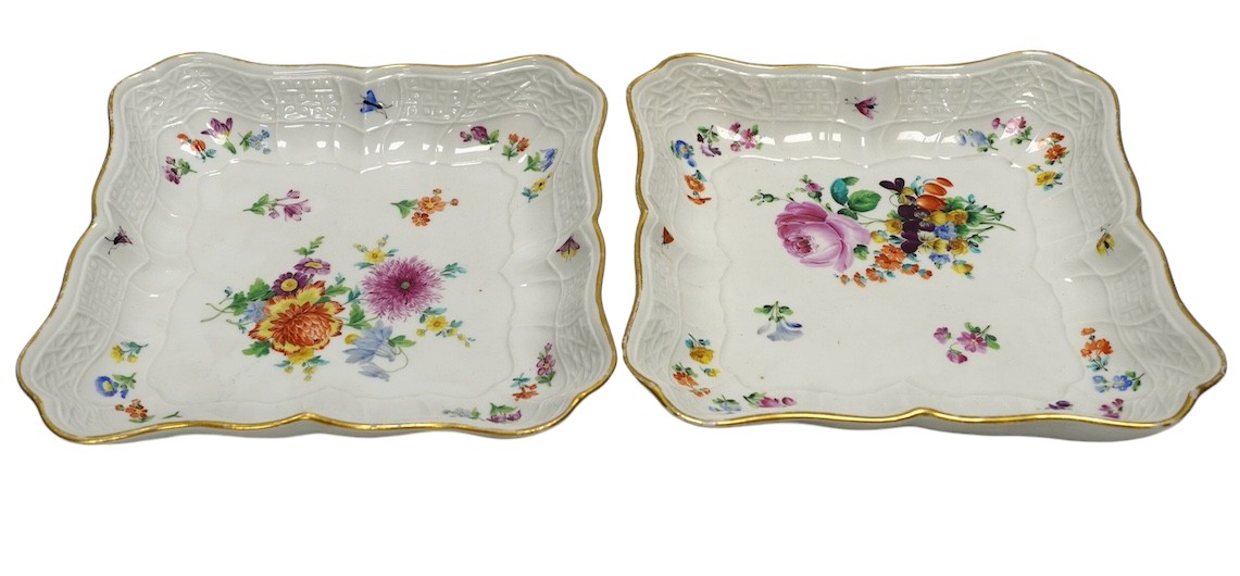 A pair of Meissen square shaped dishes, painted with scattered floral sprigs. Condition - fair to good